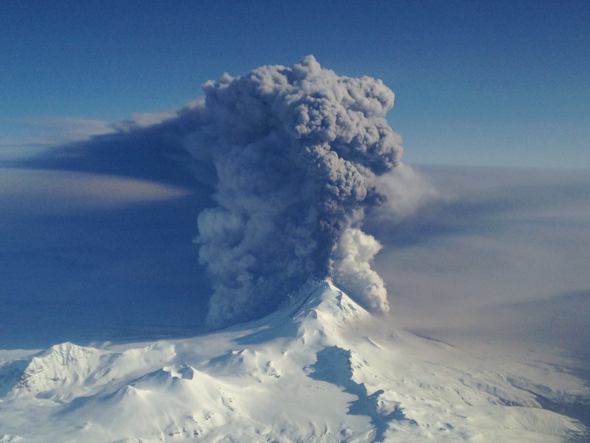 Photo by U.S. Coast Guard Lt. Cmdr. Nahshon Almandmoss Pavlof volcano erupts on March 28, 2016. The photo was taken looking northeast from a Coast Guard Hercules aircraft at 20,000 feet.