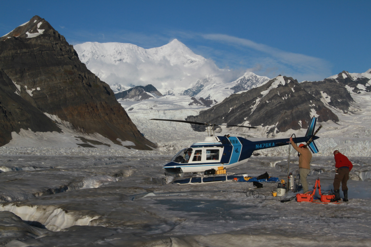 A team of researchers from University of Alaska Fairbanks maintain GPS and seismic equipment to record ice motion and icequakes at Yahtse Glacier, Alaska. Photo by Tim Bartholomaus.
