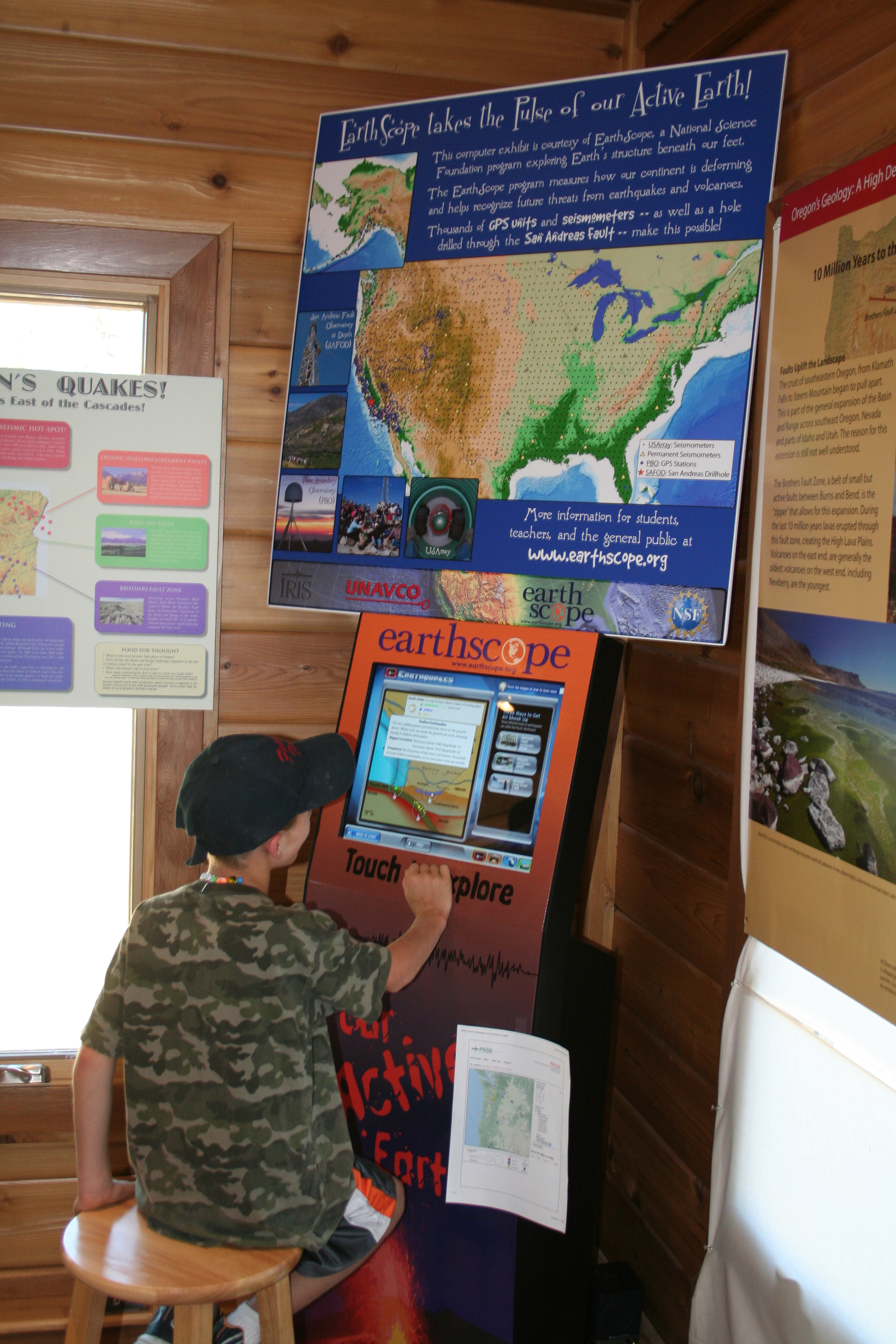 A young scientist explores one of the educational kiosks. 