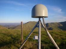 The accelerometer installed at P248, clamped to the vertical leg of the GPS monument. (Photo Doerte Mann, UNAVCO)